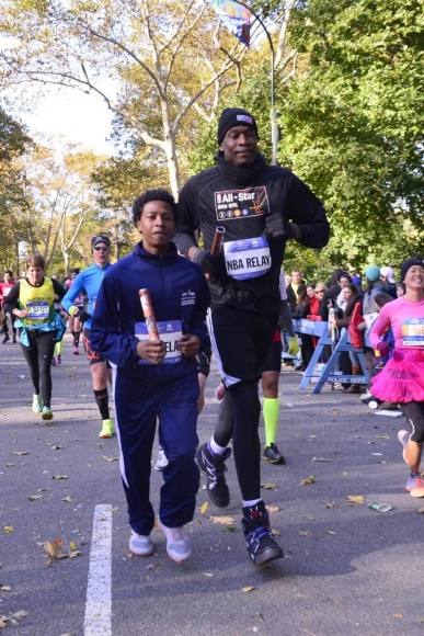 Crossing The Line: NYC Marathon Finishers Get Blocked By Dikembe Mutombo