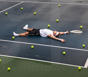 John Isner's a Day Short at Wimbledon
