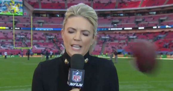 A Stray Football Rudely Interrupts an NFL Network Report by Melissa Stark