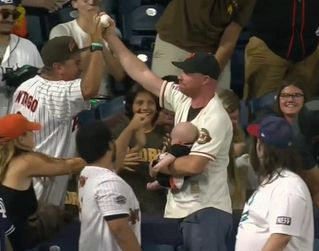 Let's Watch This Giants Fan Catch a Homer while Juggling a Baby